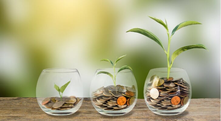 Jars filled with an increasing amount of coins, and increasingly taller plants sprouting from them.