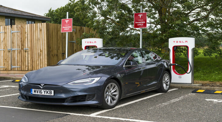A Tesla at an electric charging station.