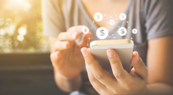 A woman uses a mobile banking app.