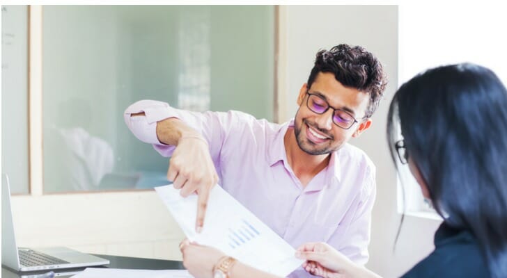 An advisor and client review the pros and cons of investing in mutual funds.