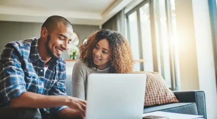 A couple research how to invest $100,000.