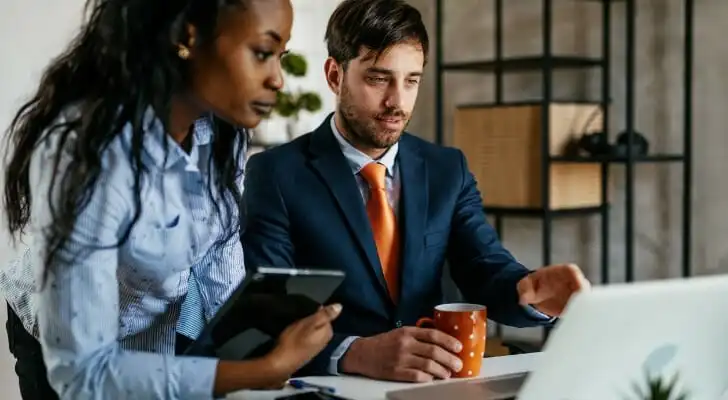 An advisor and client review types of investments.