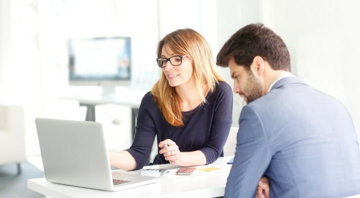 Employees review stock options that are part of their compensation packages.