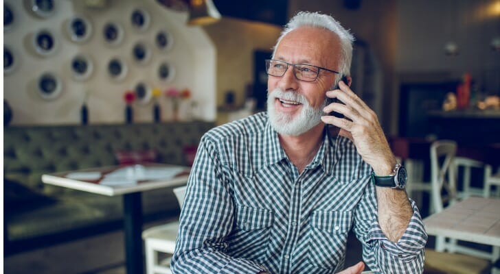 A retiree discussing retirement strategies with his financial advisor.