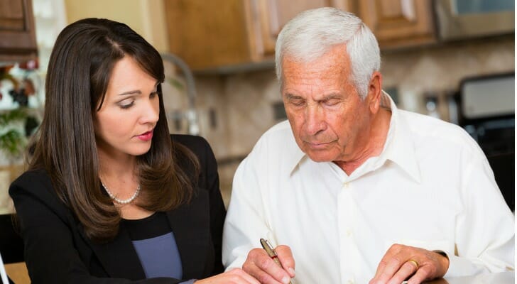 A man reviews his will with his estate planning attorney.