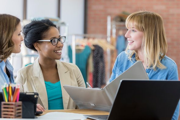 Financial advisors discuss how to set up an investment portfolio for a client.