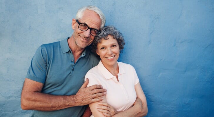A smiling couple, having just set up a marital trust.