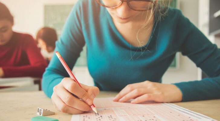 A woman taking the CFA exam.