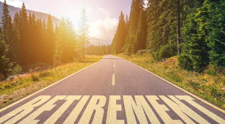 A road with "RETIREMENT" painted in yellow.