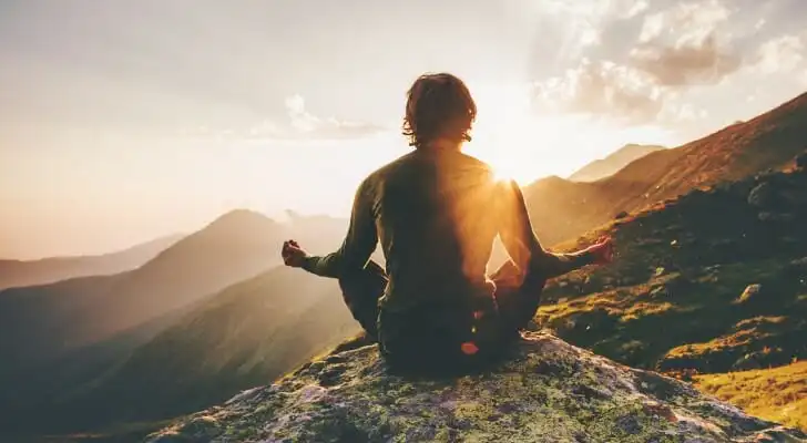 An investor meditates on their travels, having funded their trip with making safe investments.