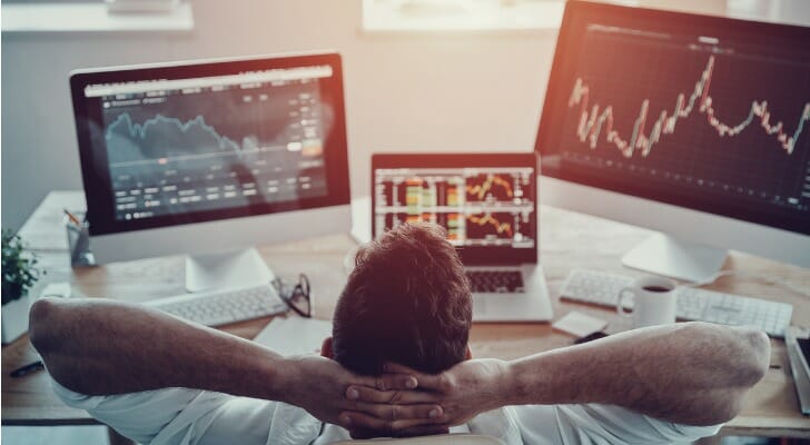 A trader researches investing in currency.