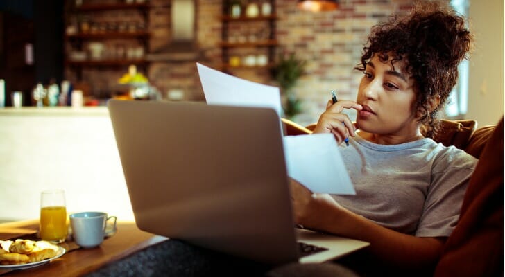 A woman reviews her variable expenses as part of her budget.