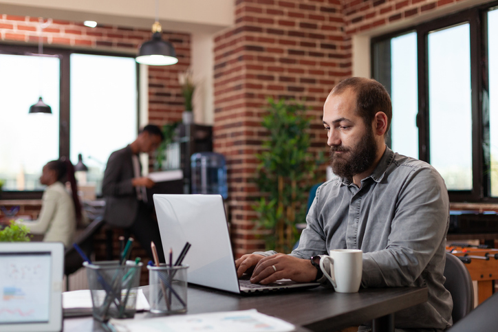 An investor reviews his portfolio on a computer.