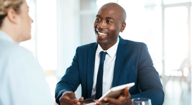 An advisor discusses with a client what a ChFC can do.