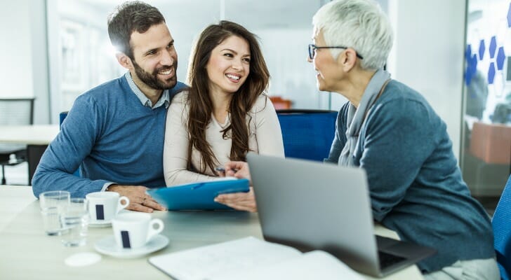 Couple talks with their chartered retirement planning counselor (CRPC).
