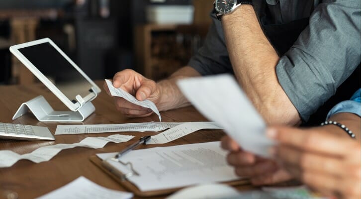 A sole proprietor reviewing how to file taxes.