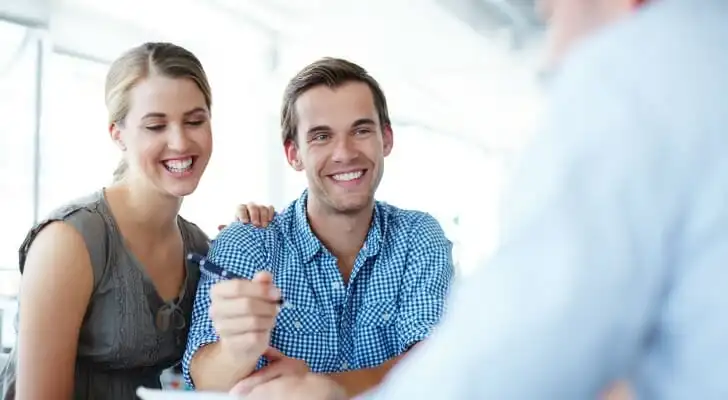 A couple deciding whether it's worth paying a financial advisor 1%.