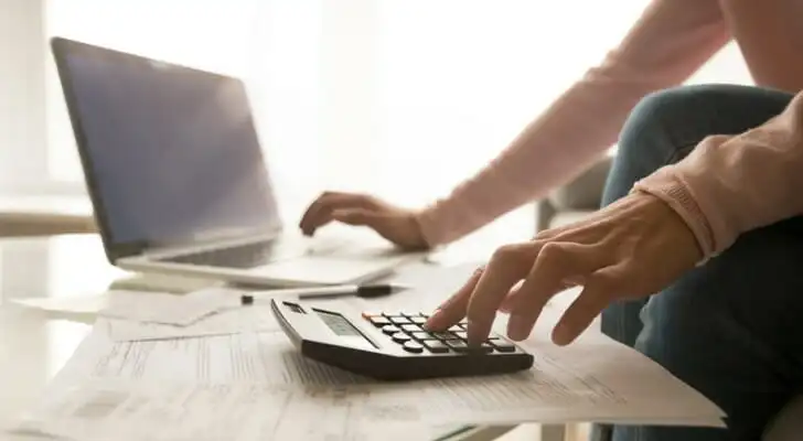 A conservator reviews relevant financial documents.
