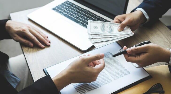 SmartAsset: What Is a Pyramid Scheme?