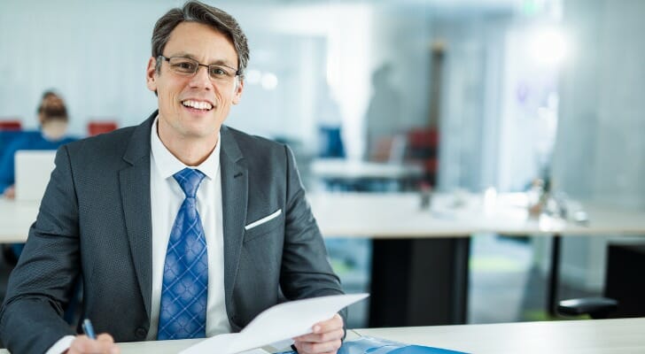 an insurance agent reviews reinsurance paperwork