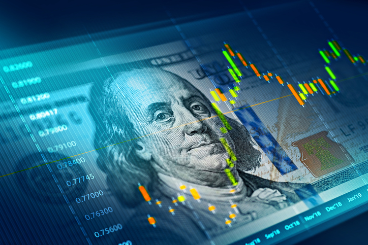 The stock market chart on 100 dollar bill background.