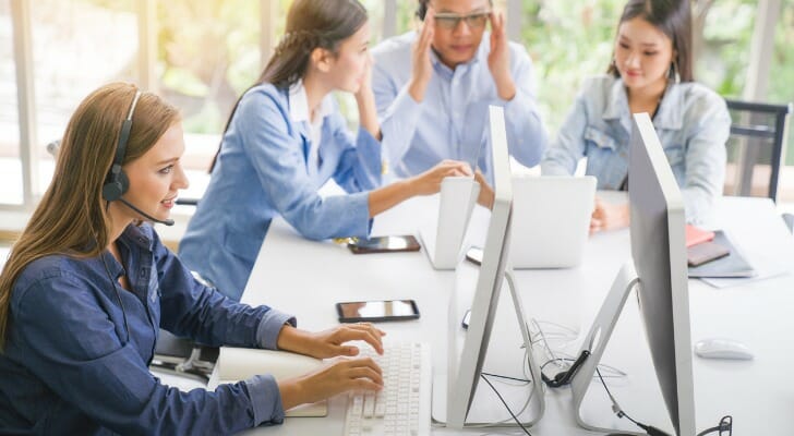 Financial professionals discussing securities licenses.