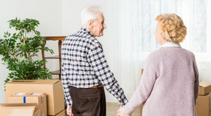 A couple discuss nursing home insurance options.