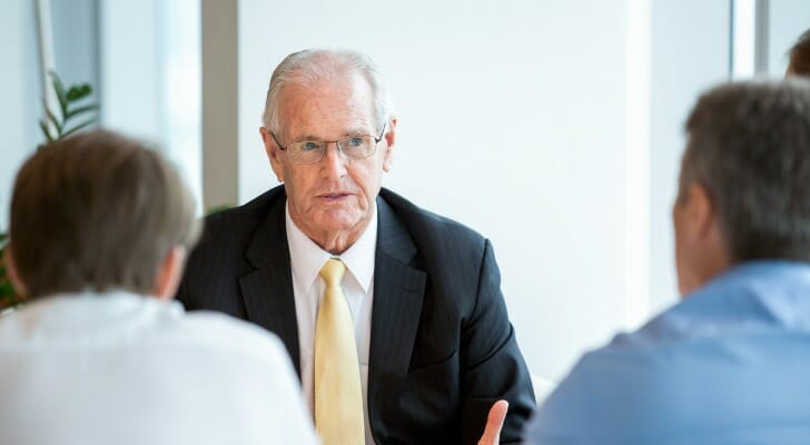 An advisor discussing asset management with clients.