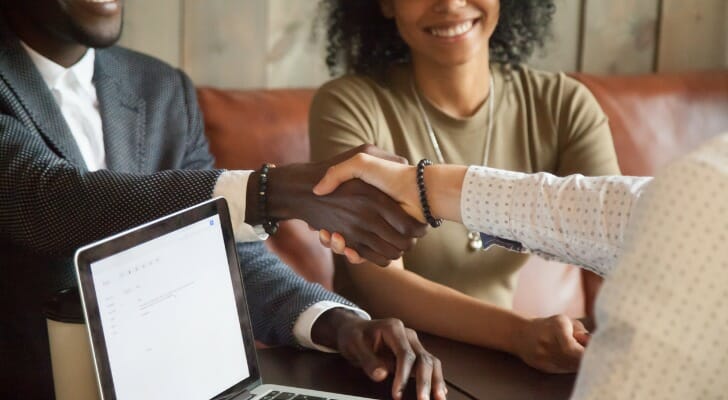 A couple meet with their advisor to discuss whether a grantor trust is right for them.