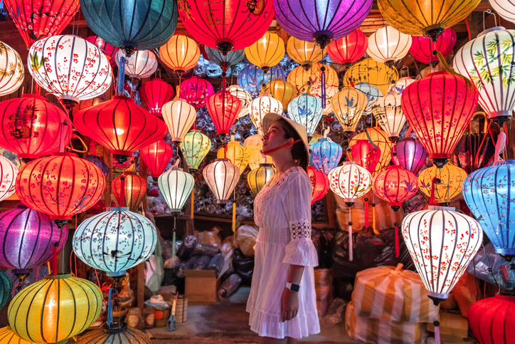 A woman looking at lanterns in Hoi An, Vietnam.