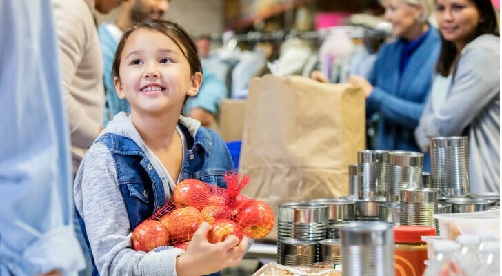 Volunteers sort food at a non-profit.