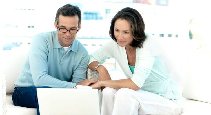 A couple prepares their taxes