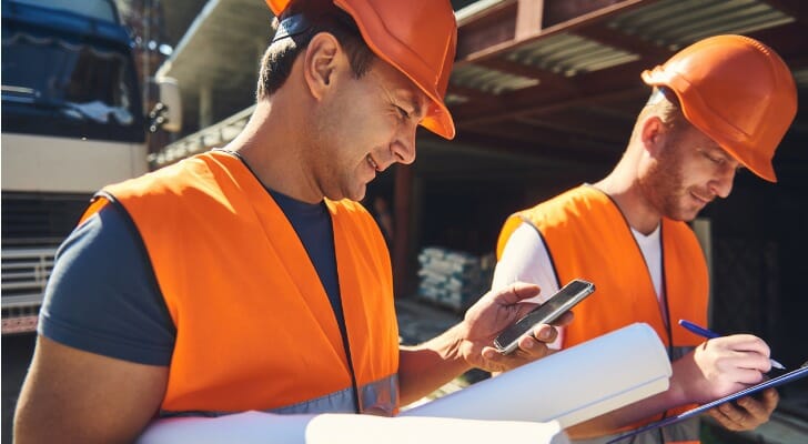 Two workers at a construction site