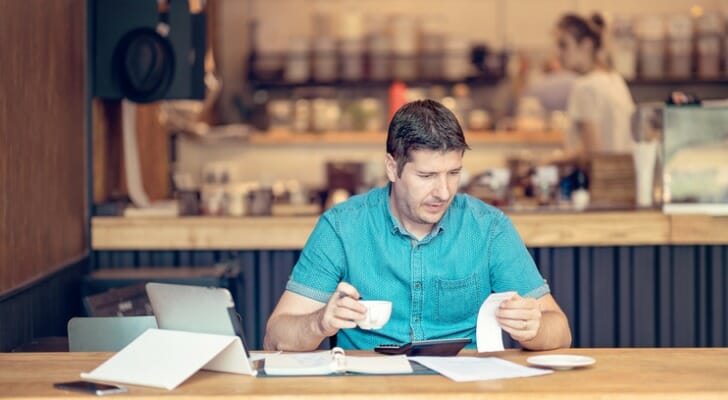 Business owner checks his cash flow