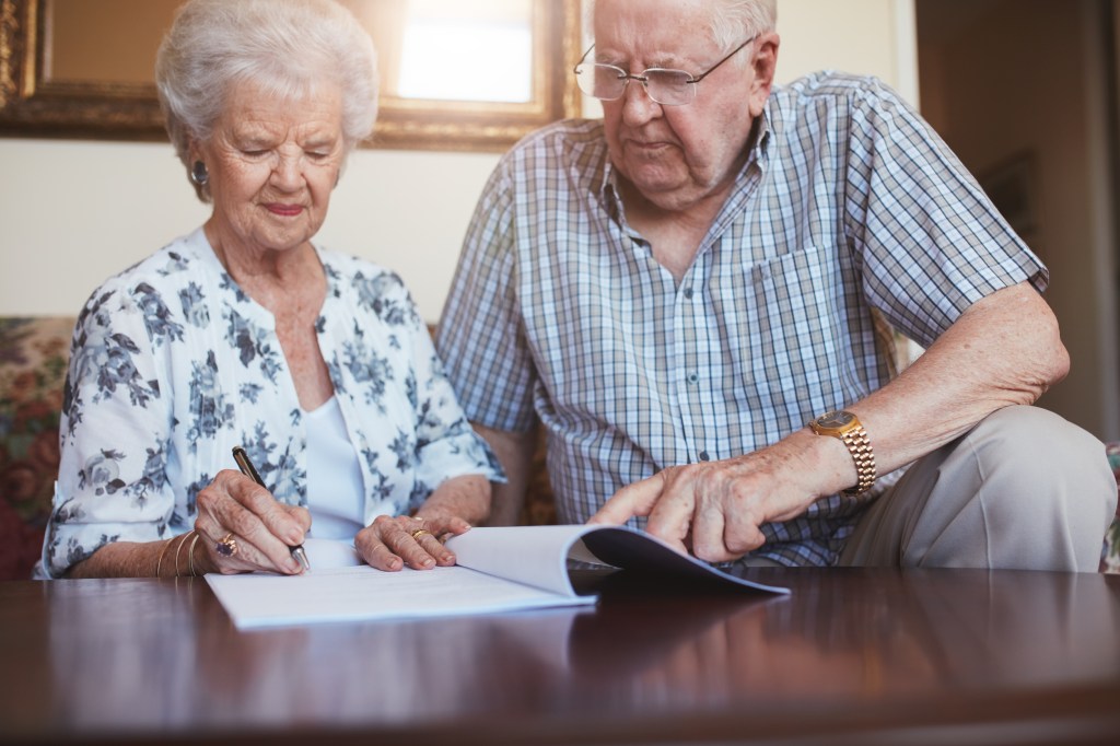 A senior couple creating a trust as part of their estate plan.
