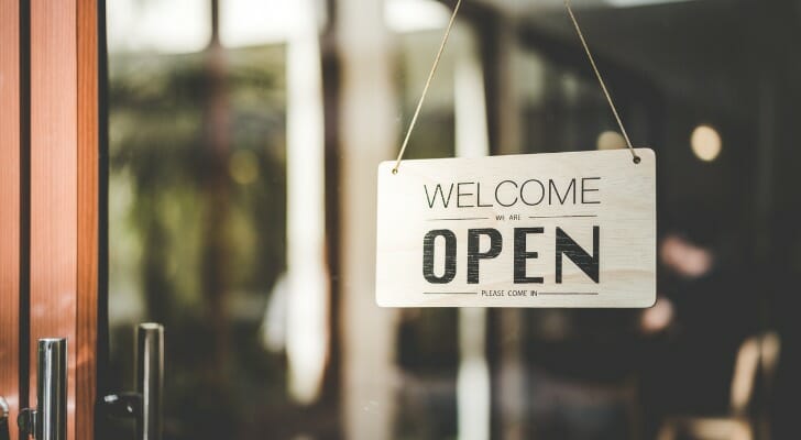 "OPEN" sign outside a small shop