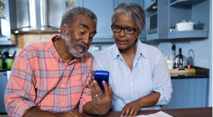 A retired couple reviewing their retirement plan.