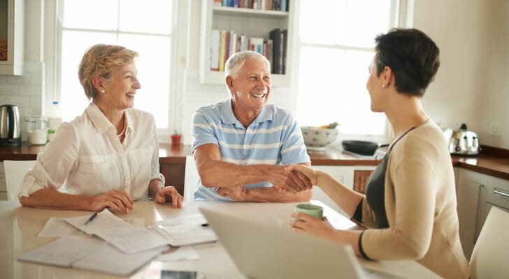Retirement advisor talks with clients.