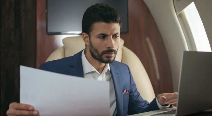 An ultra-high-net-worth individual flying in a private jet.