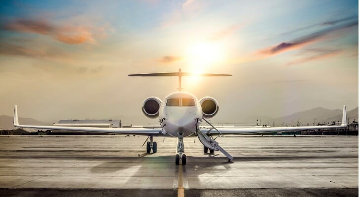 A private jet waiting for the arrival of an ultra-high-net-worth individual in the top 1%.