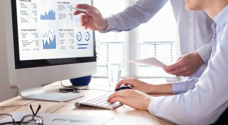 Analysts check a financial report