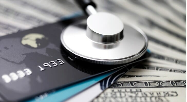 Money, credit cards and a stethoscope