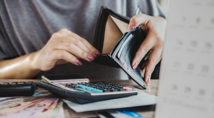 Woman holds an empty wallet