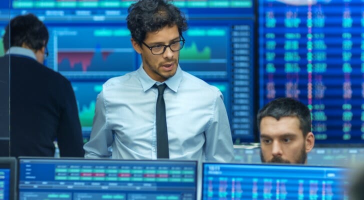 Investors reviewing microcap stocks.