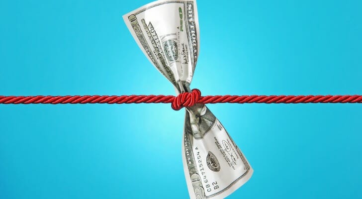 Rope squeezing a dollar bill