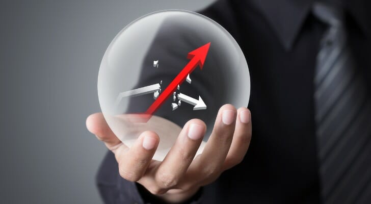 Businessman holds crystal ball