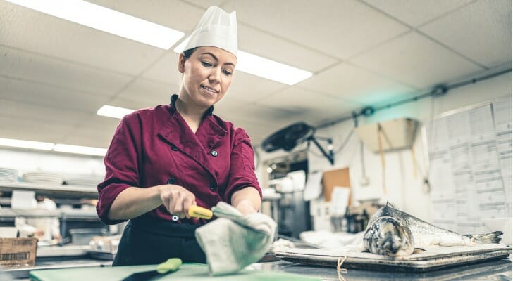 Chef working in her fish restaurant