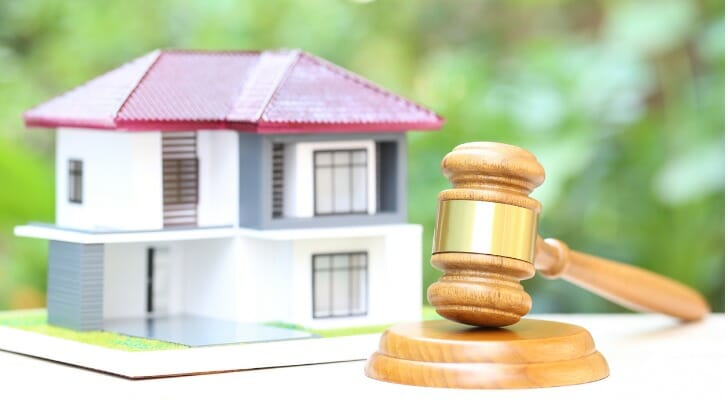 Gavel and model house