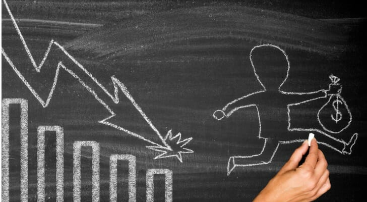 Stock index graph on a chalkboard.