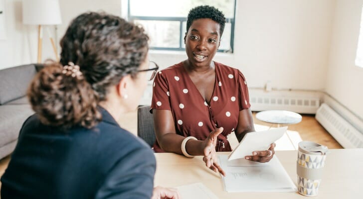 A disabled woman talks to her accountant about taxes.